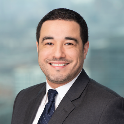 Headshot of Elvin Velez smiling at the camera.