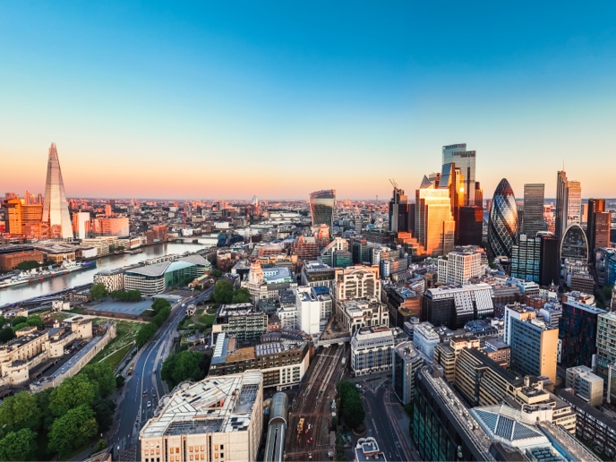 Aerial view of the finance district in London at sunset.