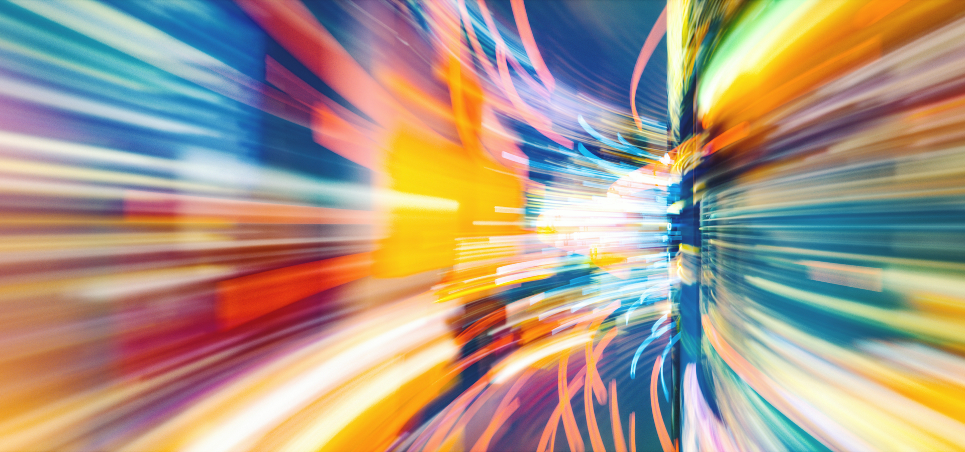 Abstract composition of multicolor lines to show fast movement around a bend.