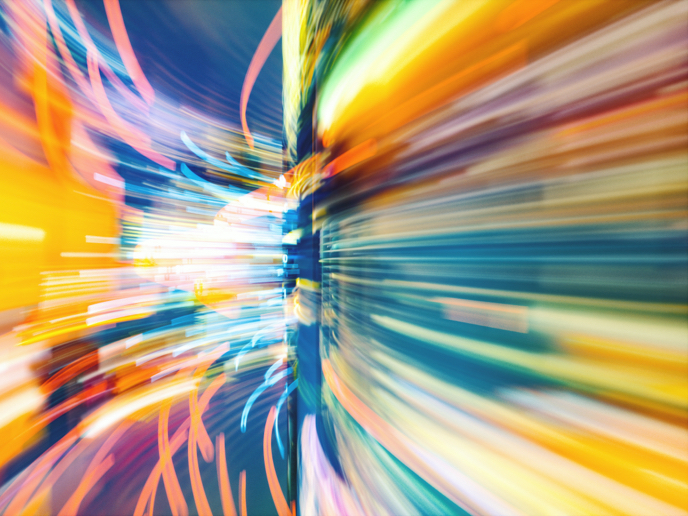Abstract composition of multicolor lines to show fast movement around a bend.